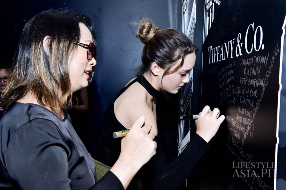 Jenni and Aryanna Epperson, writing on Tiffany Graffiti wall