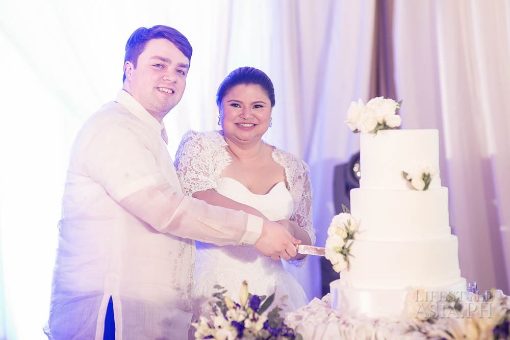 A slice of the three-tiered wedding cake