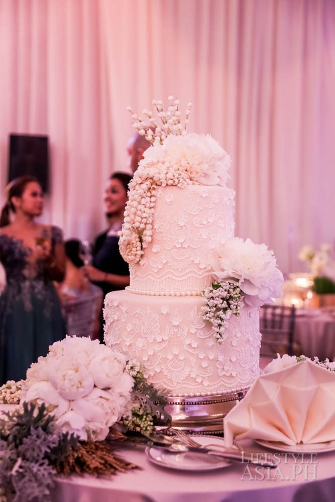 The wedding cake by Heny Sison was a creamcheese pound cake decorated with rosal, sampaguita, peonies, palay and white pearls