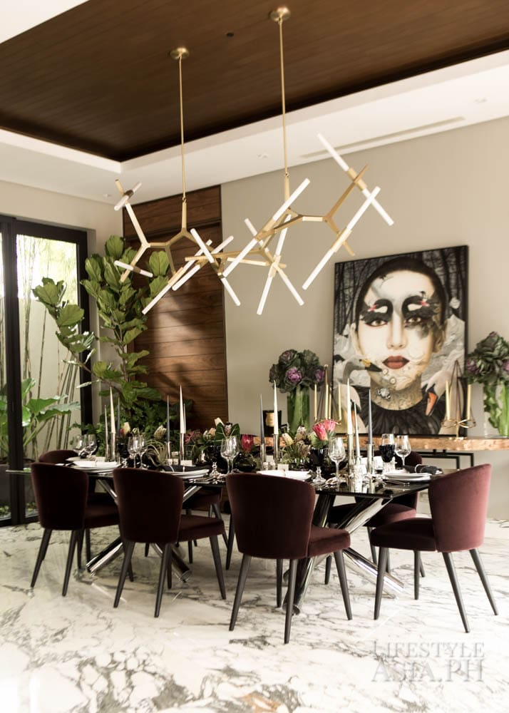 Tropical blooms and towering greens are arranged to look like they were plucked straight out of the garden