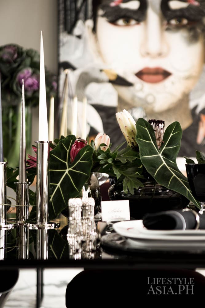 Plants from Lanai add color and contrast to the contemporary dining space