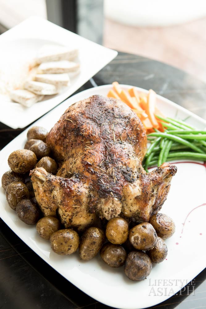 Roast chicken served with hummus