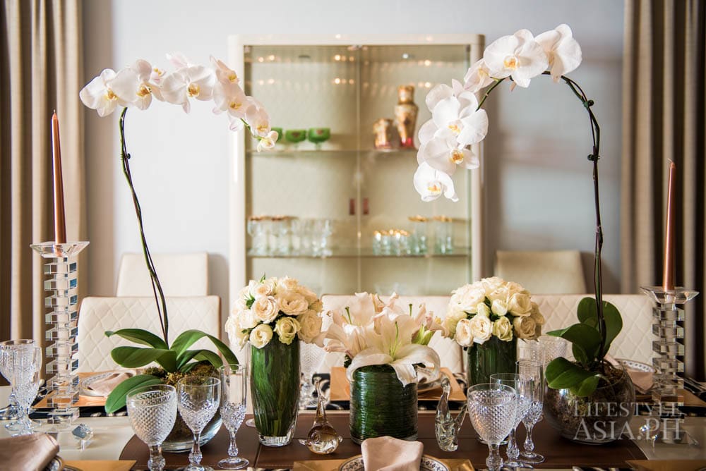 Dette's 10-seater Alf Italia table i dressed with heirloom Noritake china and white Phalonopsis