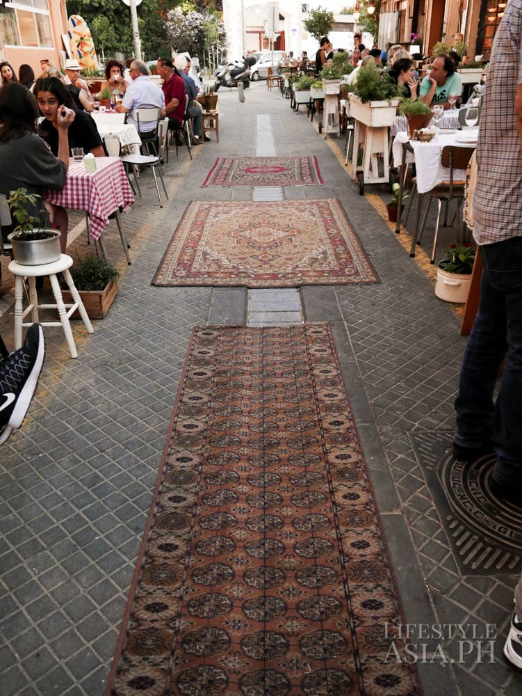 Carpets are rolled out on the streets by night fall when restaurants bring out tables and chairs for al fresco dining