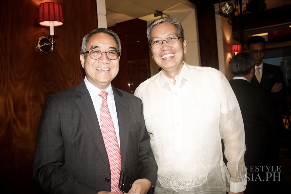 Chairman of First Metro Investment Corp. Francis Sebastian with Edgar Chua.