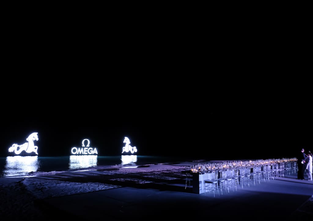 Long tables and the OMEGA logo was set up on the beach for the gala dinner