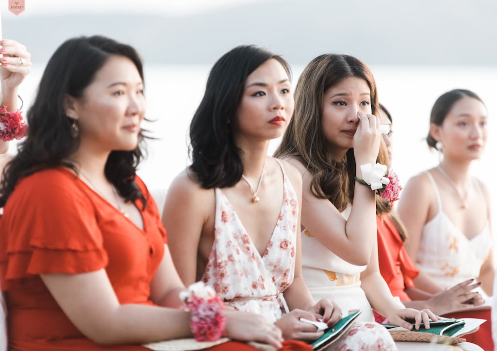 The bridesmaids getting teary eyed during the exchange of vows