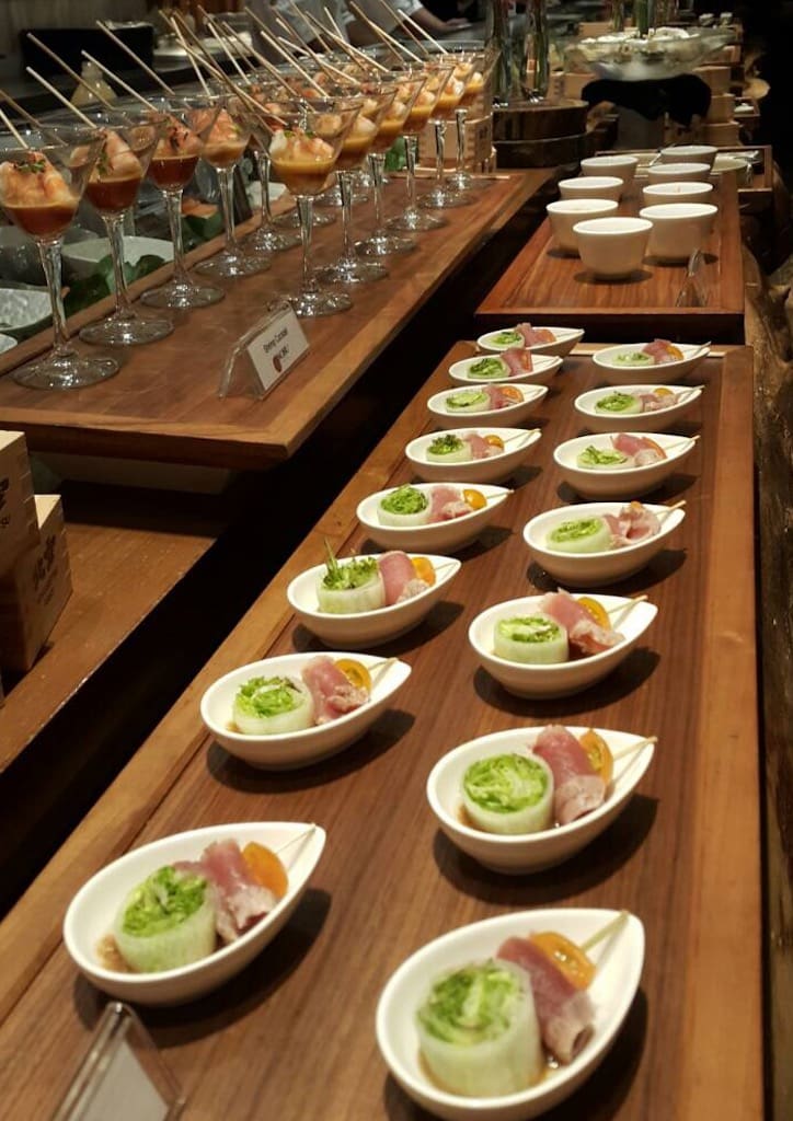 Buffet style layout of handcrafted finger food