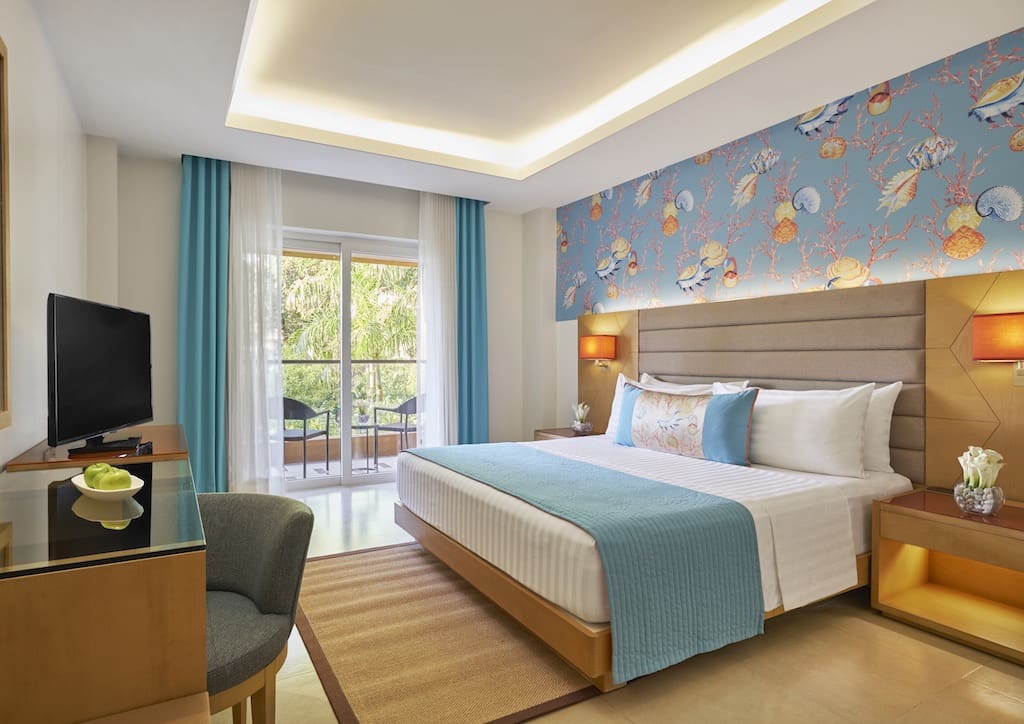 The Deluxe Sea View Room provides panoramic views of the sea