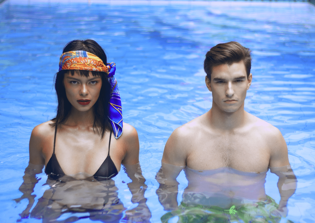 Use an Hermès scarf as a turban to look good even when in the water