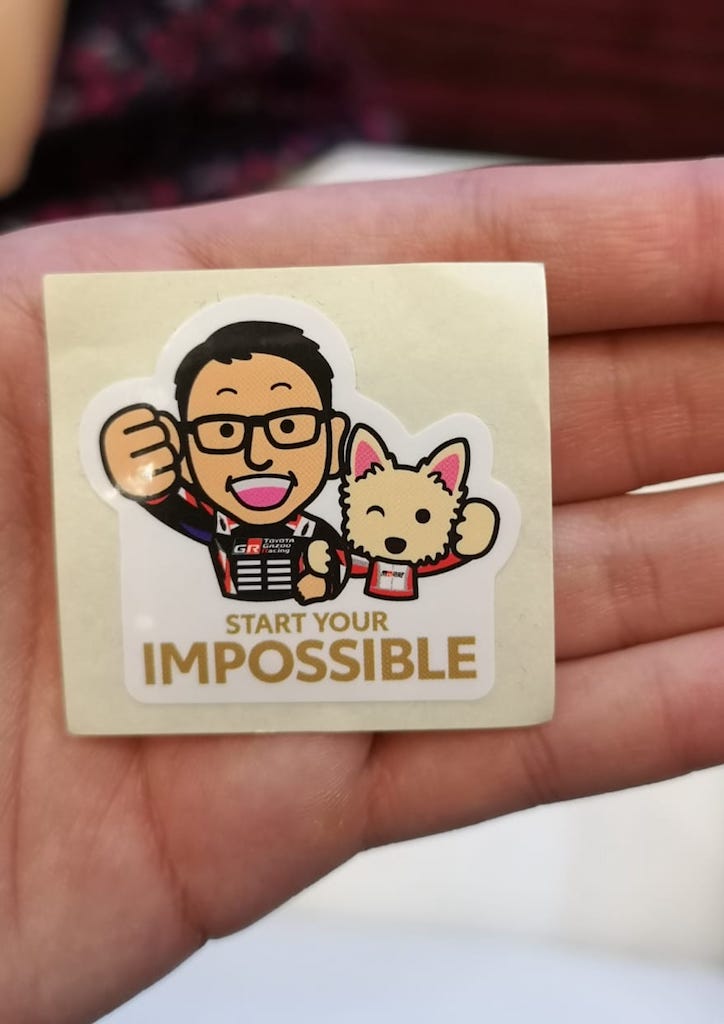 Mr. Akio Toyoda gave guests his signature stickers