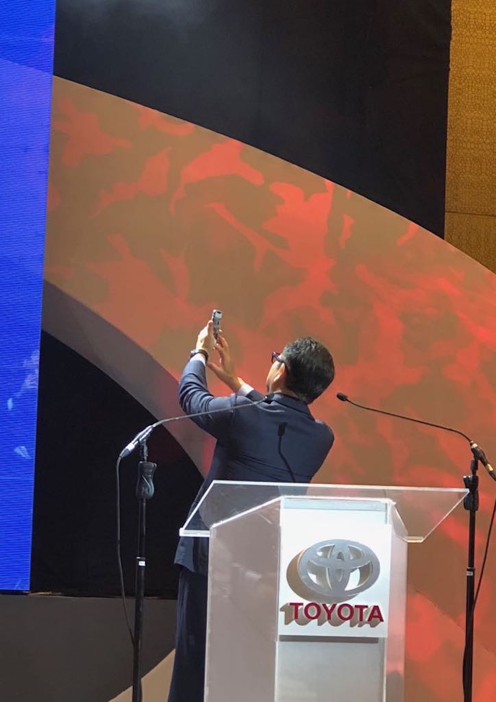 Toyota Motor Citporayion Akio Toyoda takes a selfie with the crowd