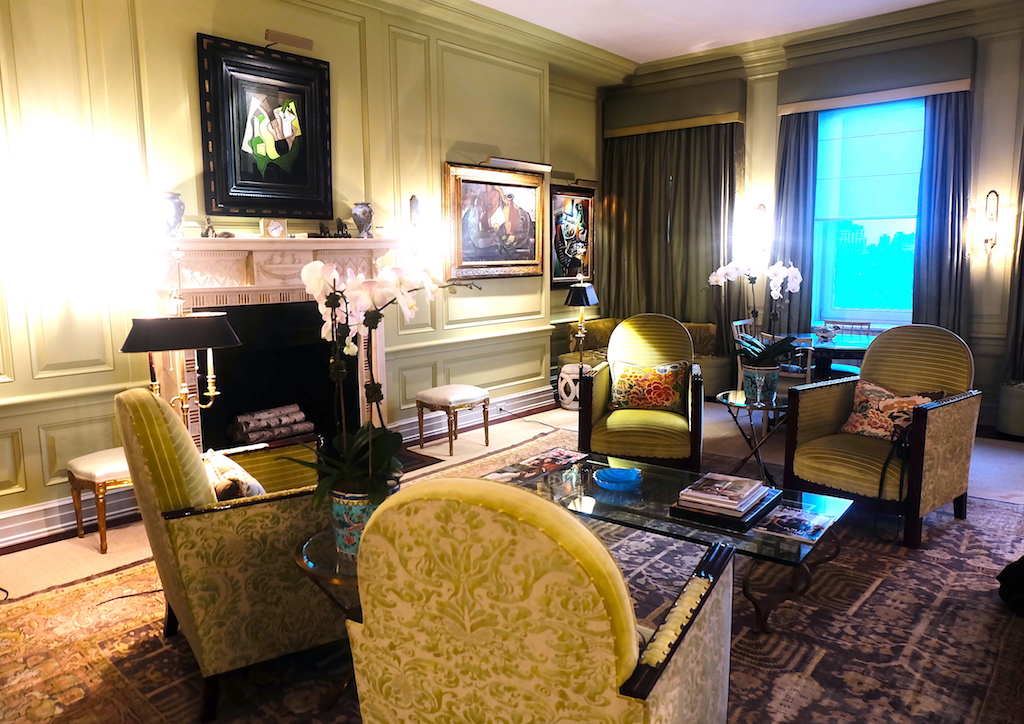 The living room's cusy furniture and decorations were matched to the space's apple green motif