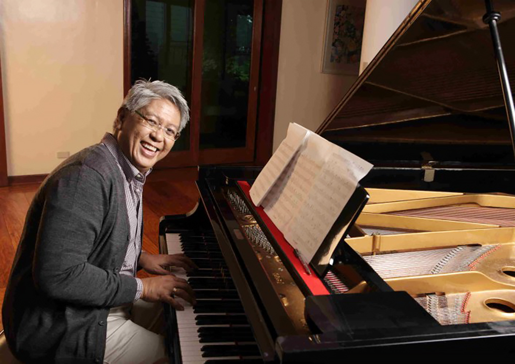 The talented composer and song writer by the piano