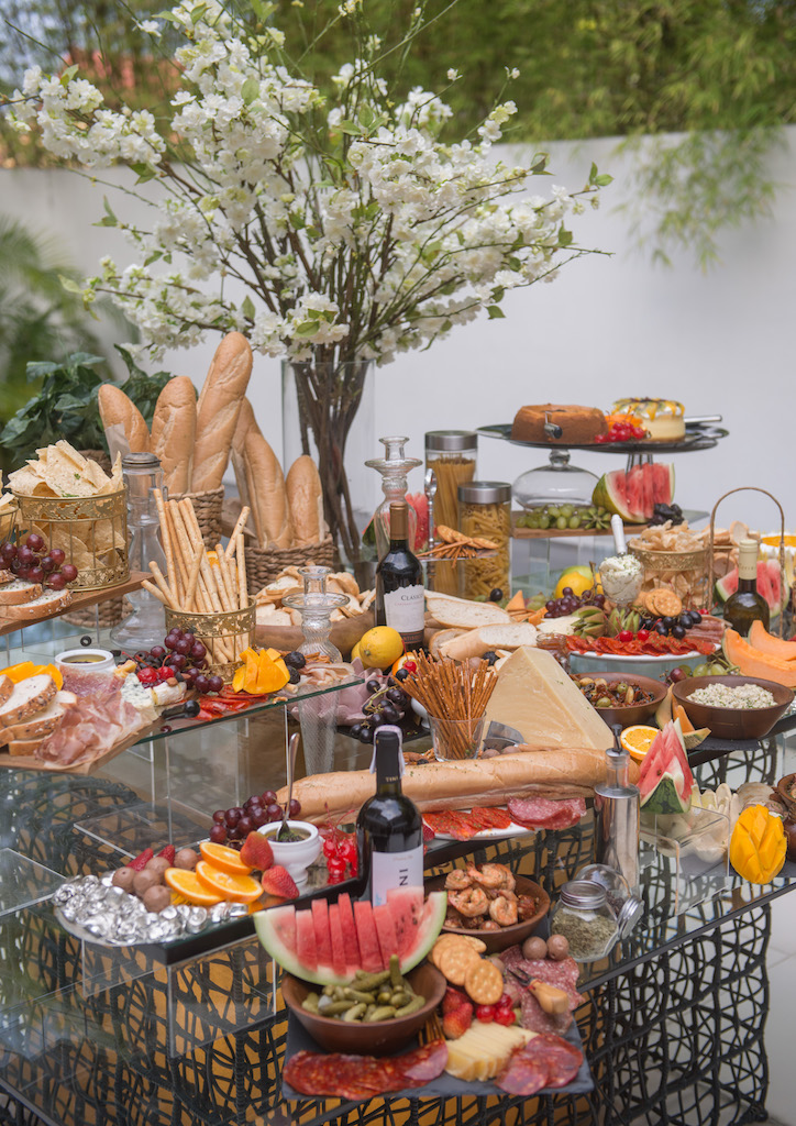 Decorative elements for Cynthia's buffet table includes risers to prop the dishes up in different levels (Photography by Kieran Punay) 