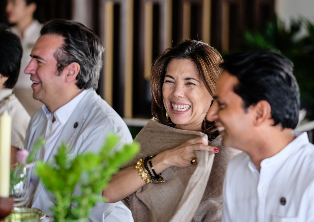 Marilen Elizalde enjoying a laugh with her guests