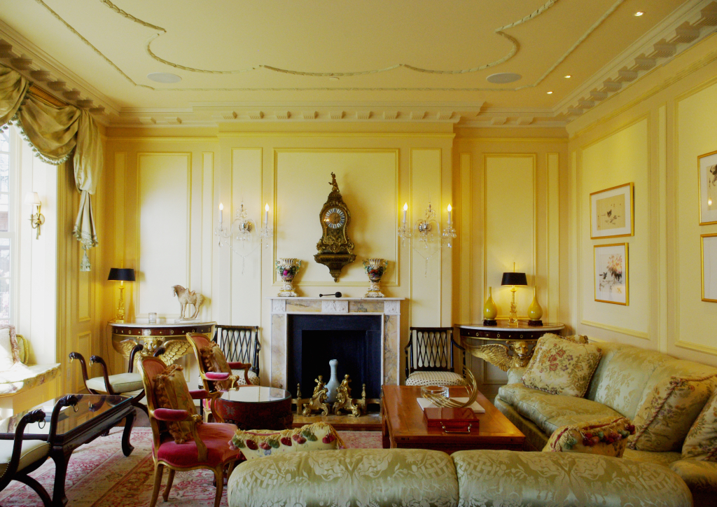 The European-Asian-inspired formal living room is filled with antiques and furnishings from different countries and centuries