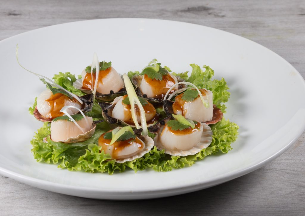 Scallop locking seafood cooked in X.O. sauce