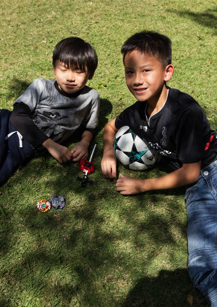 Brothers Kenzo and KenZ Teo take a break from playing in the garden (Photograph by Jack Alindahao)