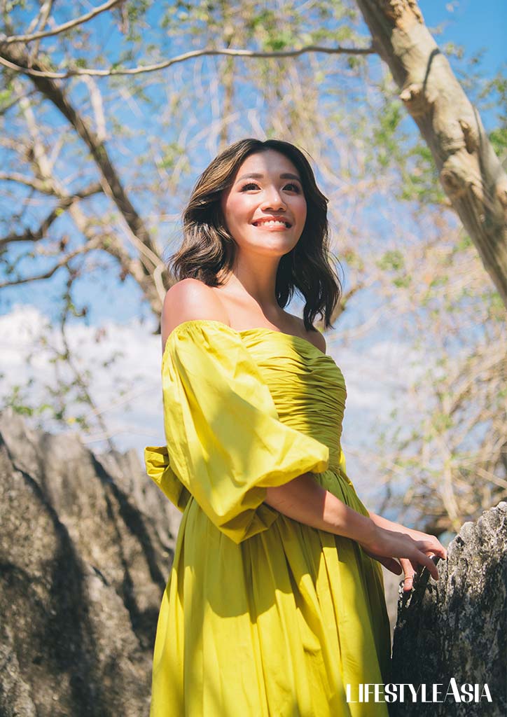 The neon yellow off-shoulder dress by Debbie Co looks good on Ryna Brito, Sunlight Air's young dynamic leader. 