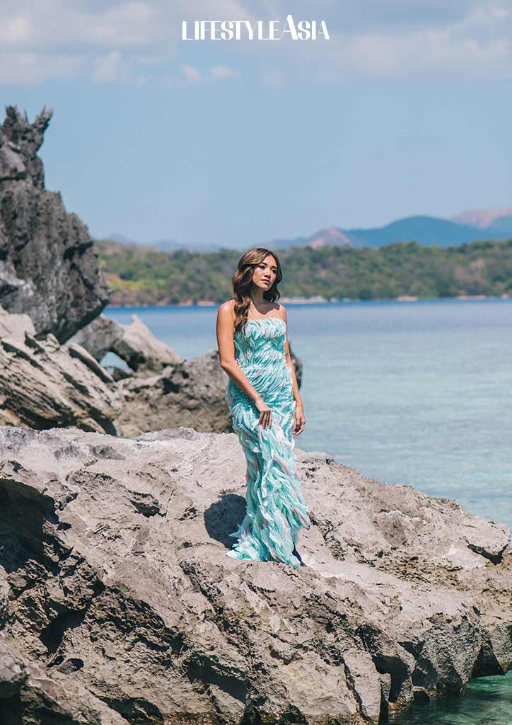 She looks wonderful in the light turquoise and bubblegum pink gown by Rosenthal Tee.