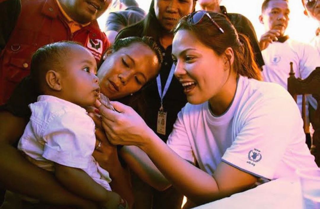 KC Concepcion doing feeding program