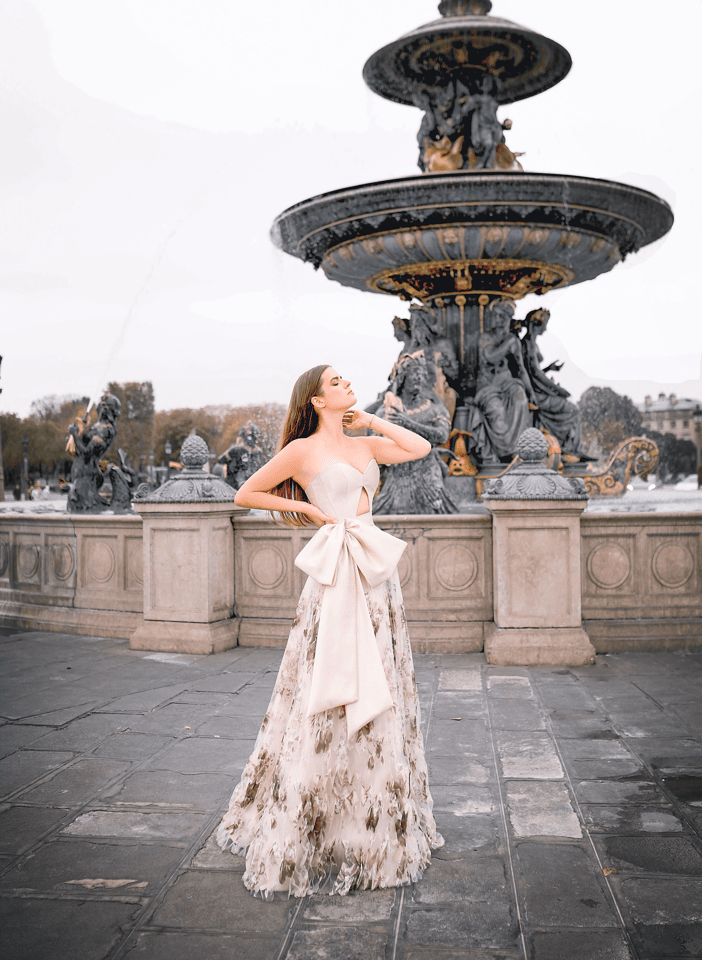 Ecru sweetheart gown with cutout detail and statement bow in silk gazar, with floral organdy skirt by Mark Bumgarner.