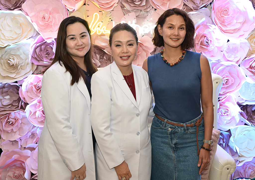 Dr. Sarrah Jane Javellana-Obal, Dr. Ma. Venia Concepcion Javellana, and Tweetie de Leon Gonzales share a moment together in a bloom of flowers