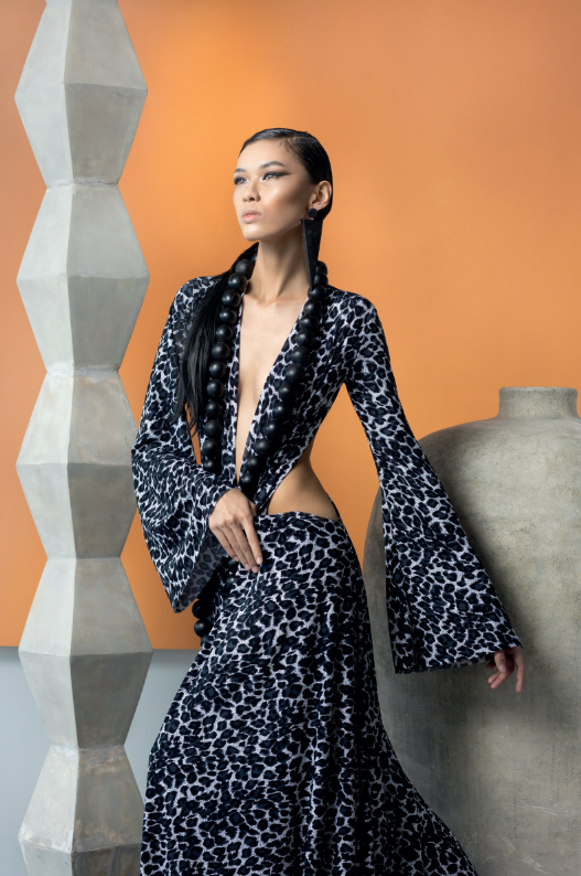 Black and white cotton jersey cutout maxi dress, by JUN ESCARIO. Beaded necklace, AVATAR by BUTCH CARUNGAY.