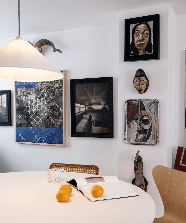 Paintings (L-R): Luis Antonio Santos and Nick Navarro; (Top to Bottom): Bjorn Calleja, an African mask , Jason Oliveria