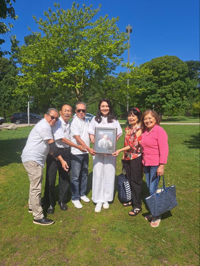 Consul General Angelica C. Escalona presents members of the Filipino community in Niagara Falls with a portrait of Rizal at the proposed site of the monument