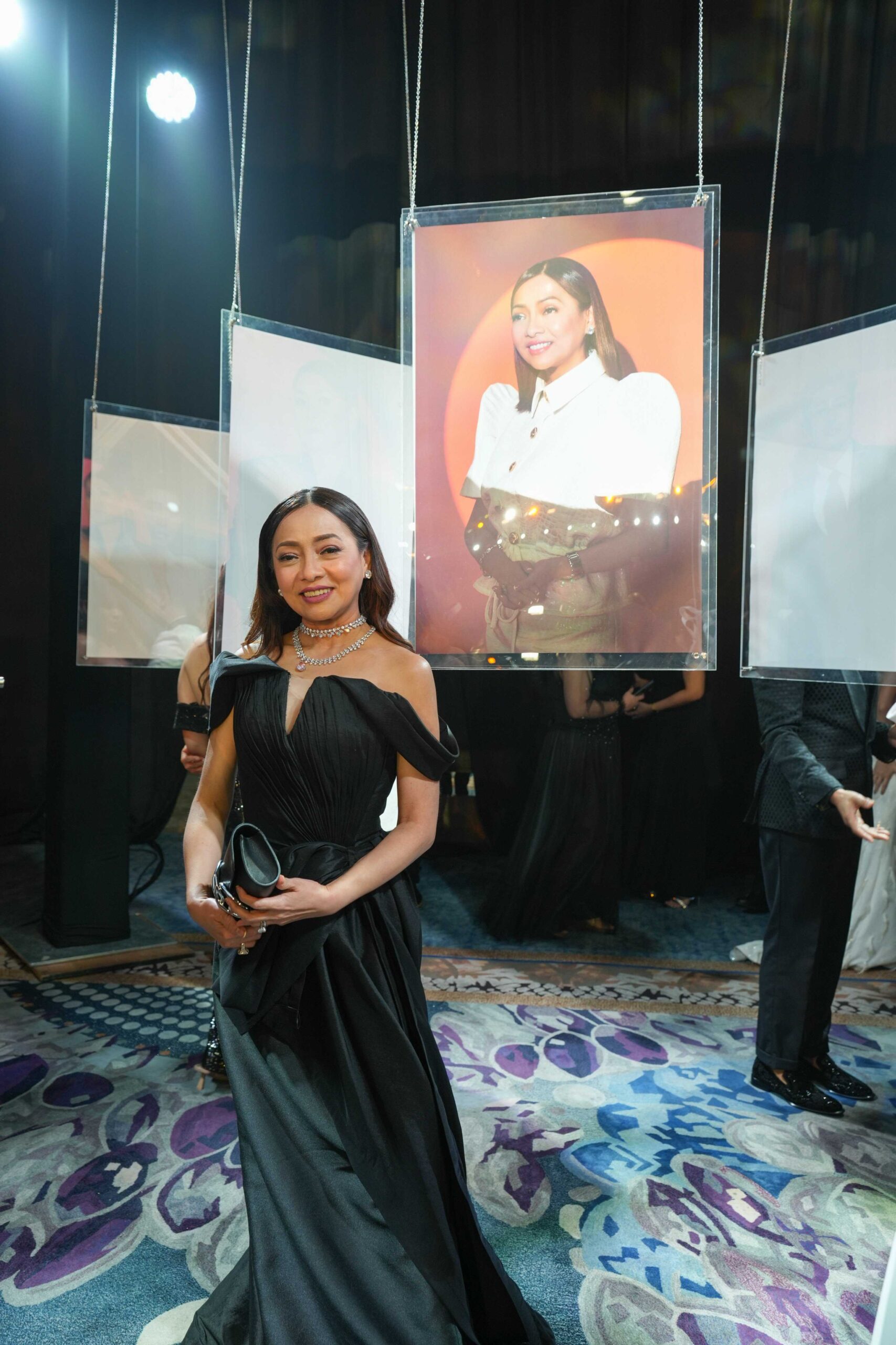 Pinky Tobiano in front of her exhibit photograph