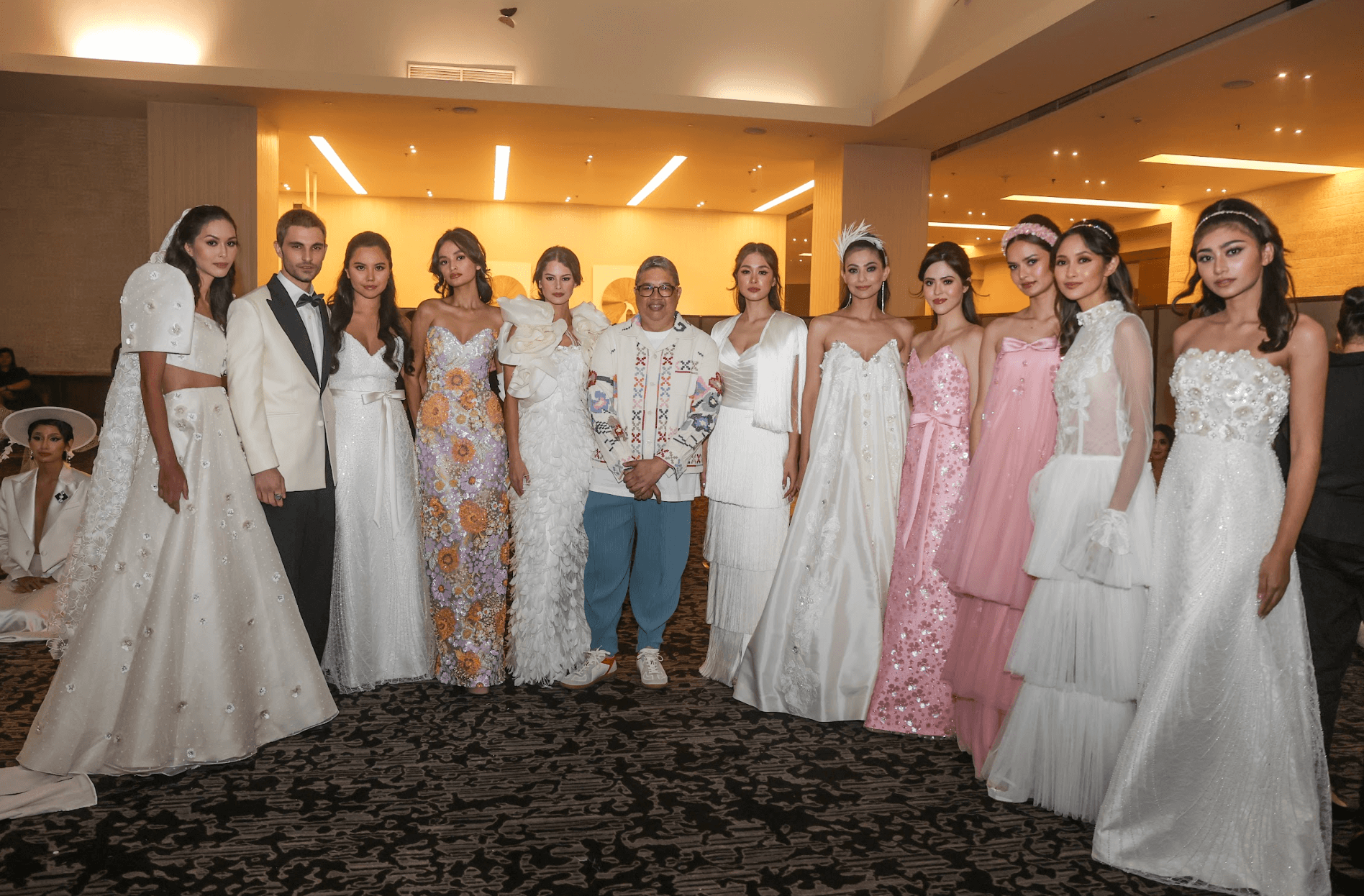 Rhett Eala surrounded with his models