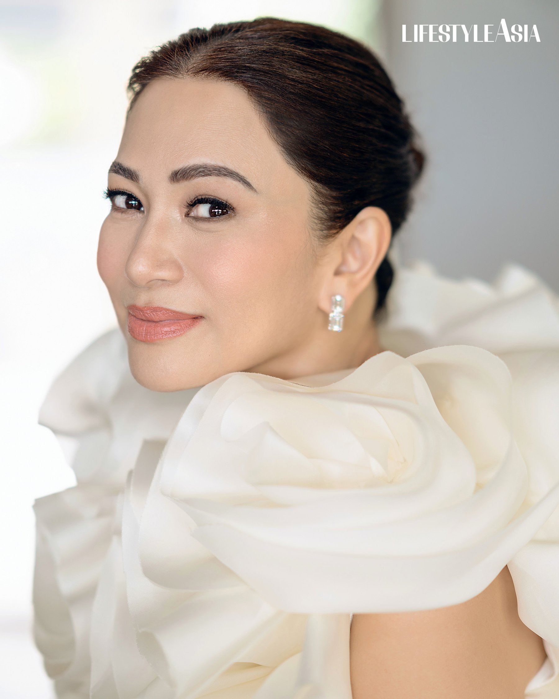 Ecru silk organza ruffled bolero top, RHETT EALA; Emerald cut diamond dangling earrings, JMA JEWELRY.