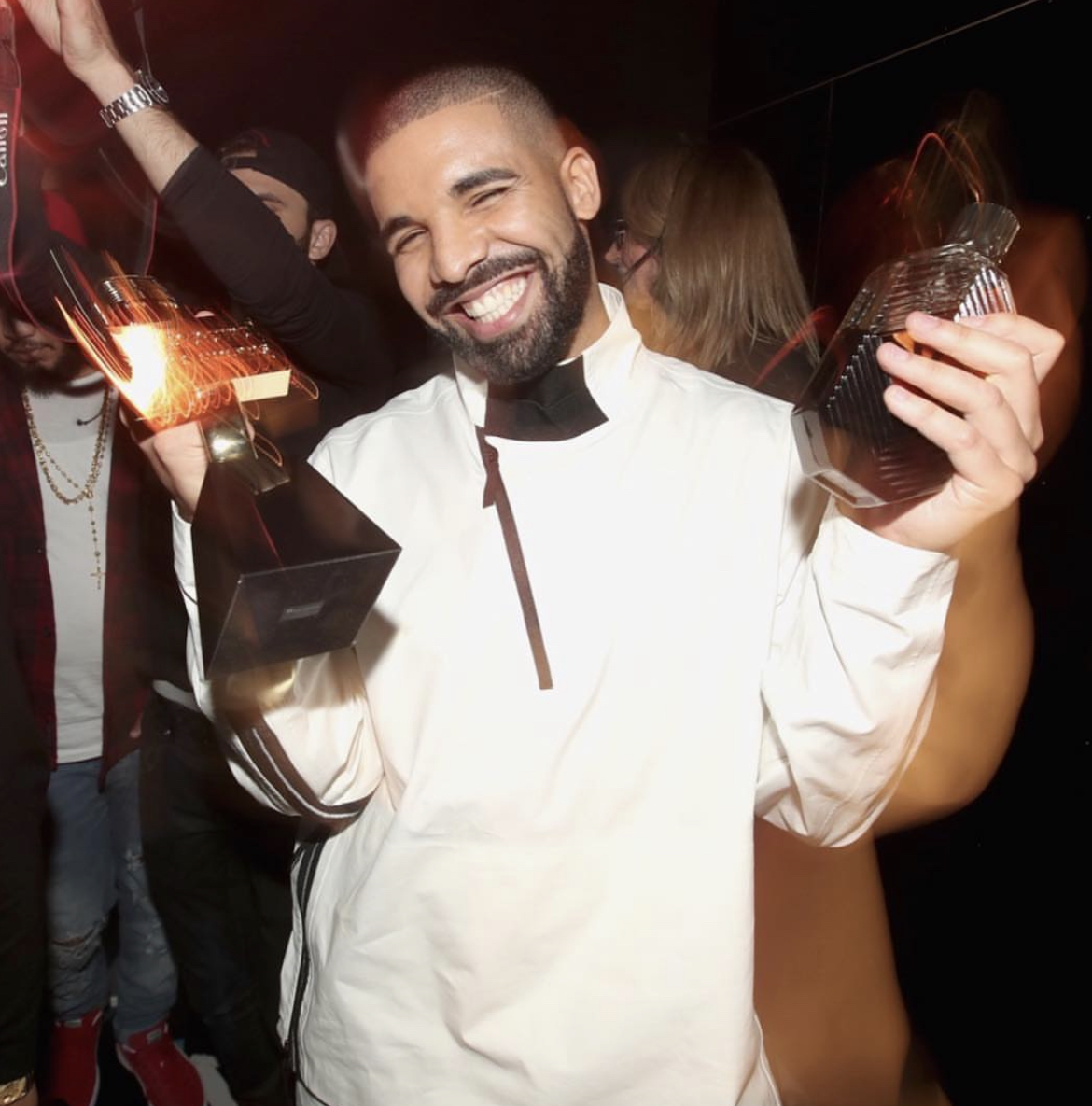Drake holding a bottle of Virginia Black Whiskey 