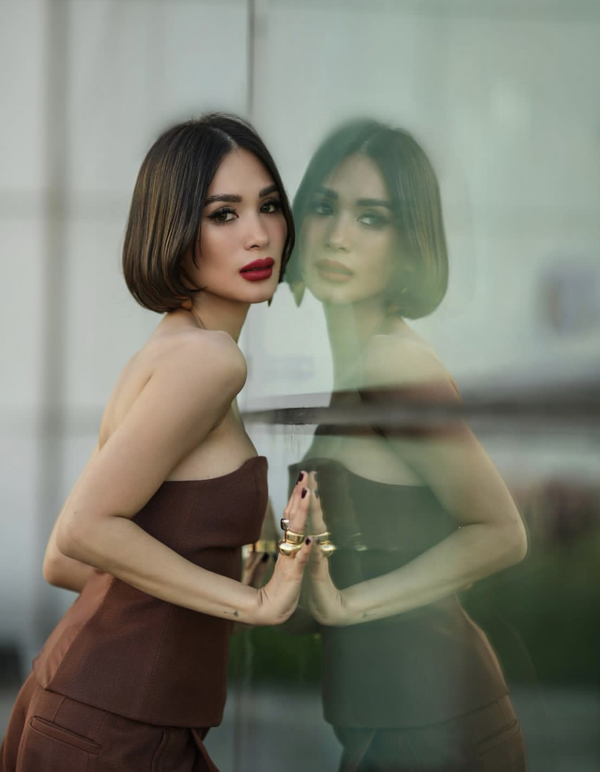 Heart poses in front of the camera.