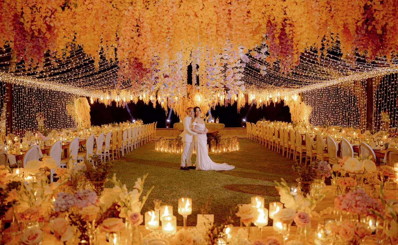 The bride and groom in Camiguin's Old Church ruins, designed by Gideon Hermosa