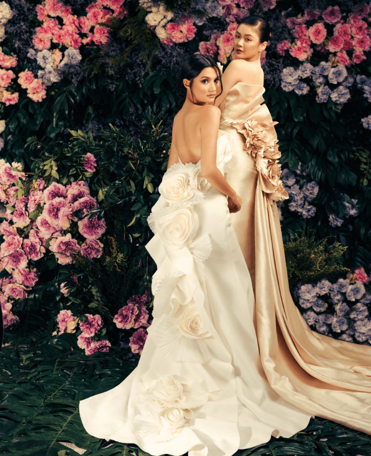 On Danielle: Ivory serpentina gown with cascading pleated accents and handcrafted roses. On Selina: Champagne Italian silk column gown accentuated with sculptural draping detail, and handcrafted flowers, by JO RUBIO.