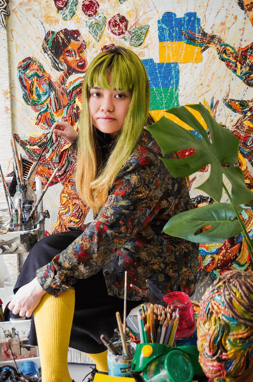 Tita Halaman with her paintings