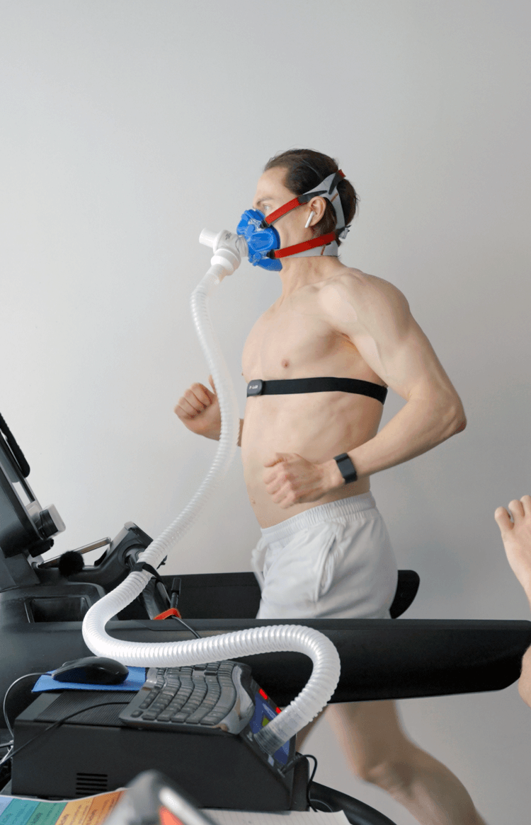 Bryan Johnson running on a treadmill with an oxygen monitor