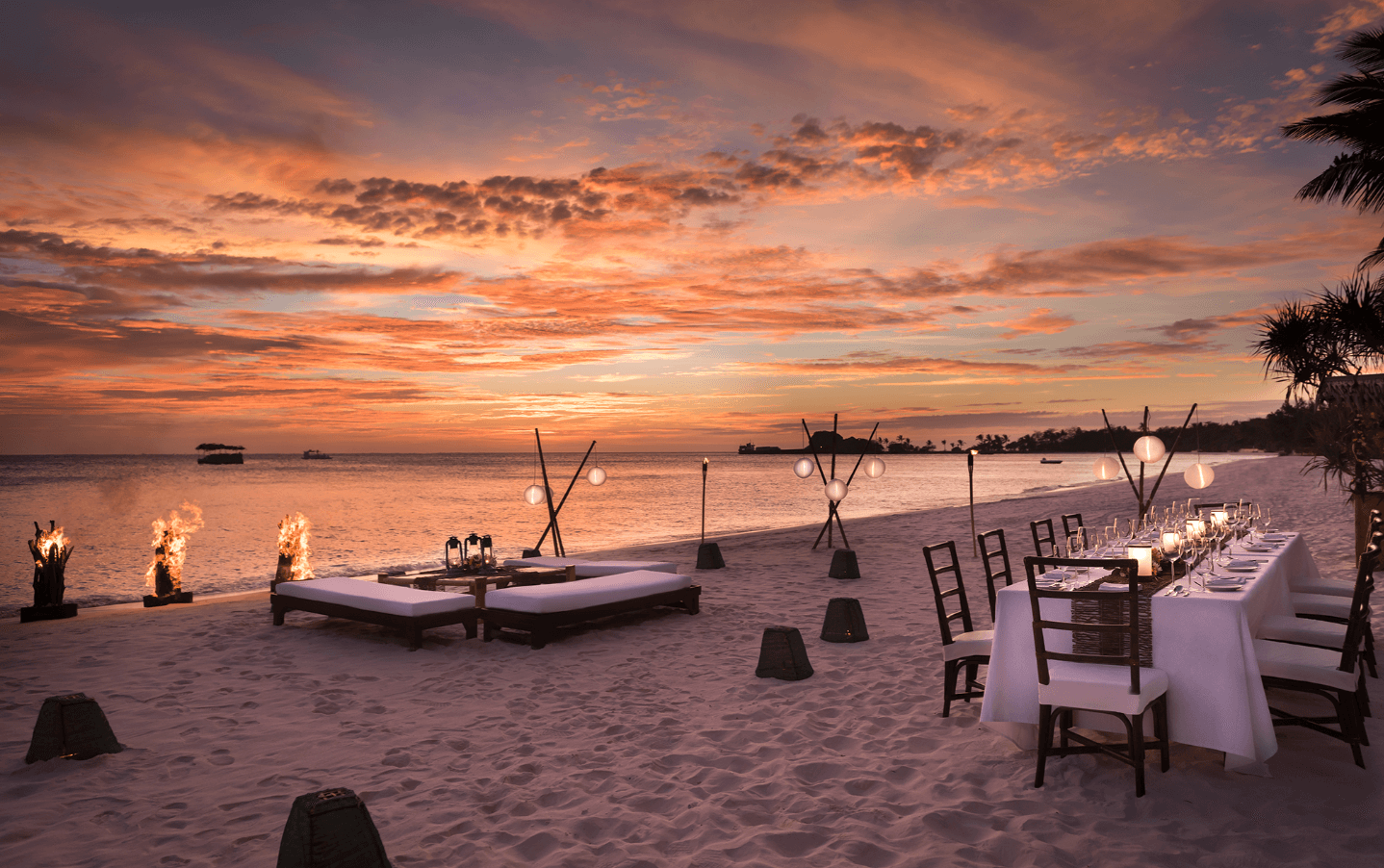 A romantic sunset beach set up in Amanpulo