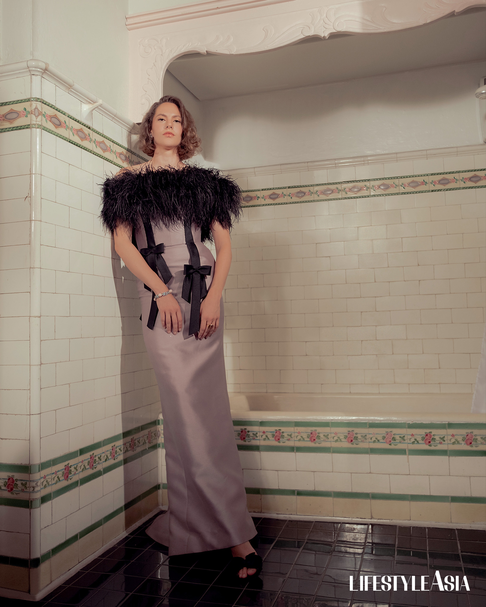 Mauve silk gazar dress embellished with feathers and ribbons, MARK BUMGARNER; Diamond and aquamarine earrings and bracelet, JANINA FOR JUL DIZON.