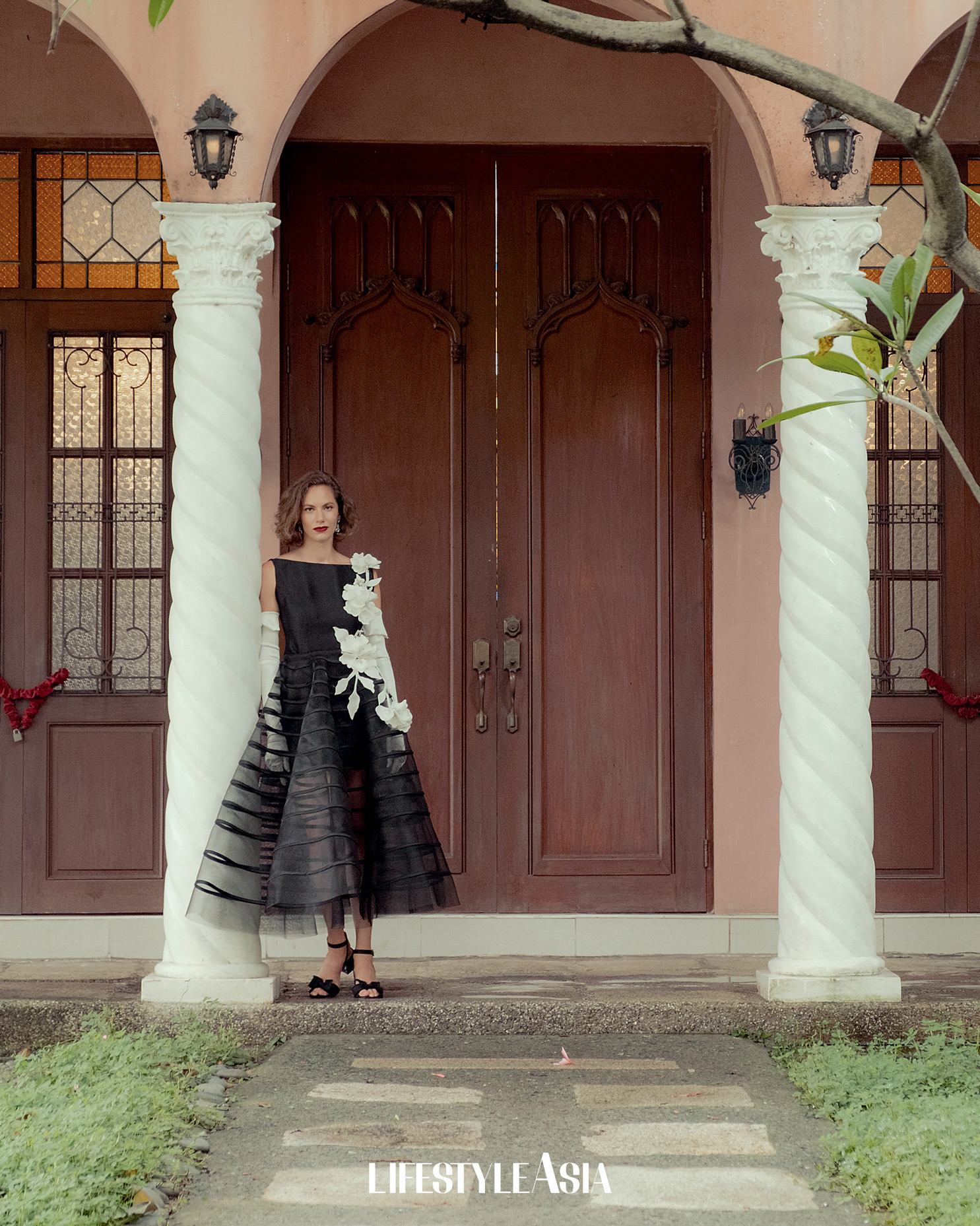 Black boat neck top and mesh petticoat skirt with white floral appliques, JO RUBIO; Onyx and pearl earrings, JUL B DIZON JEWELLERY.