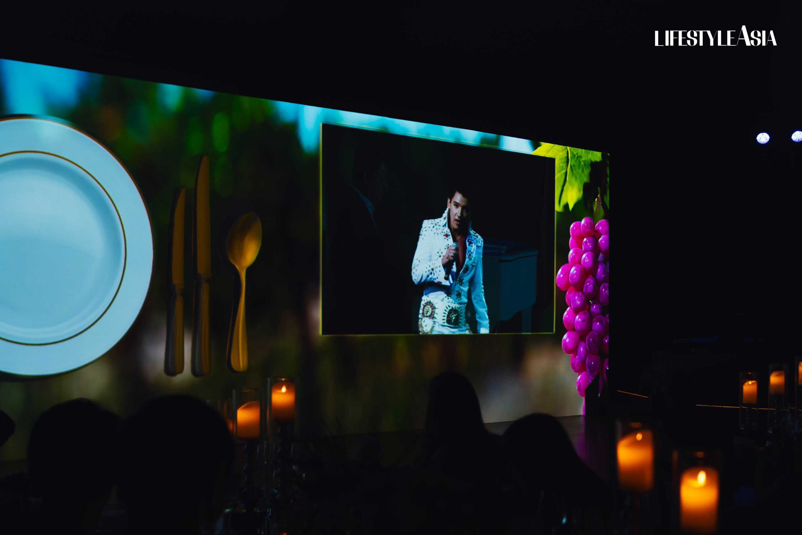 An AI-generated Elvis interacts with the audience and Manny Narciso, RCBC's Head of Global Transaction Banking Group