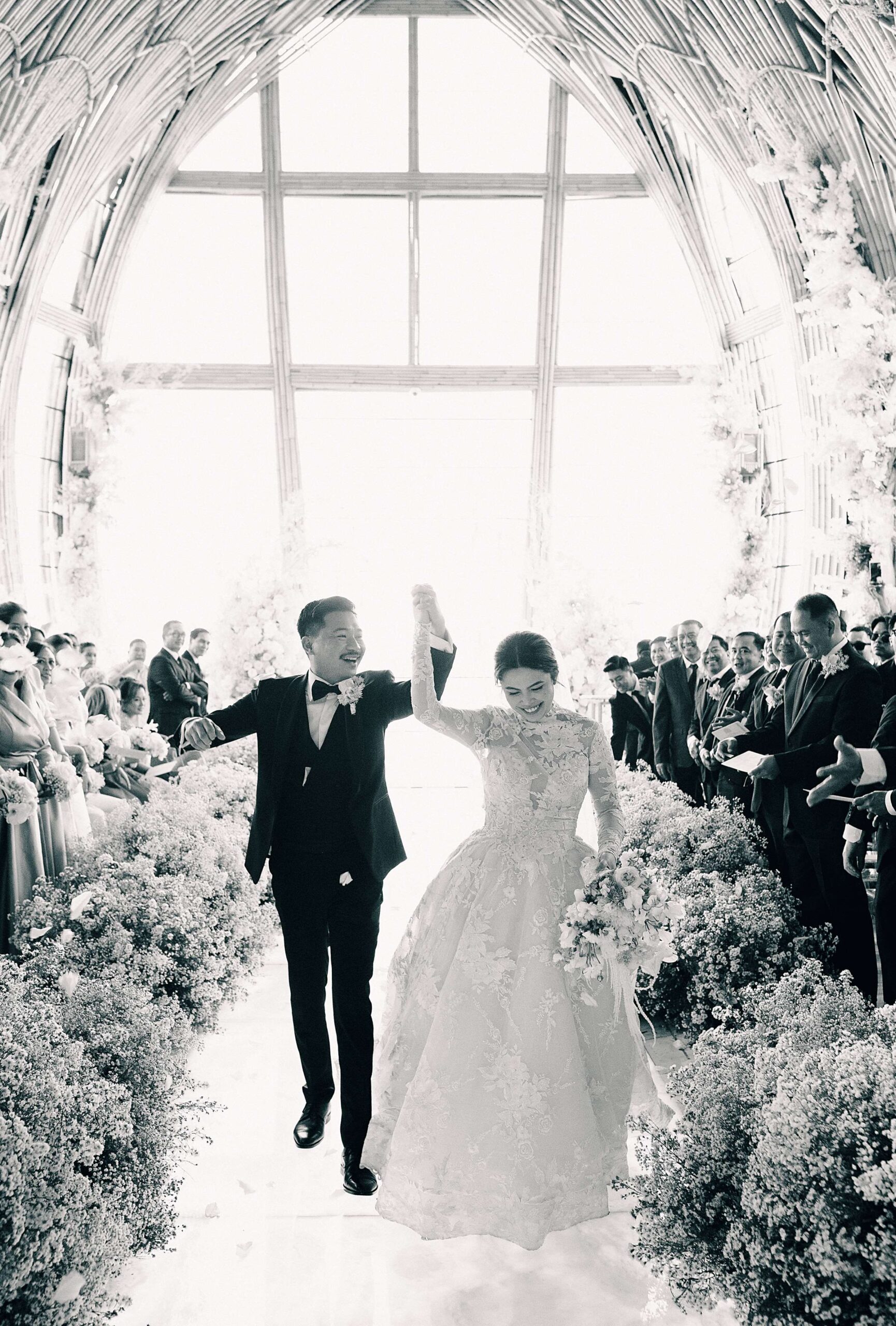 The newlyweds walking down the aisle