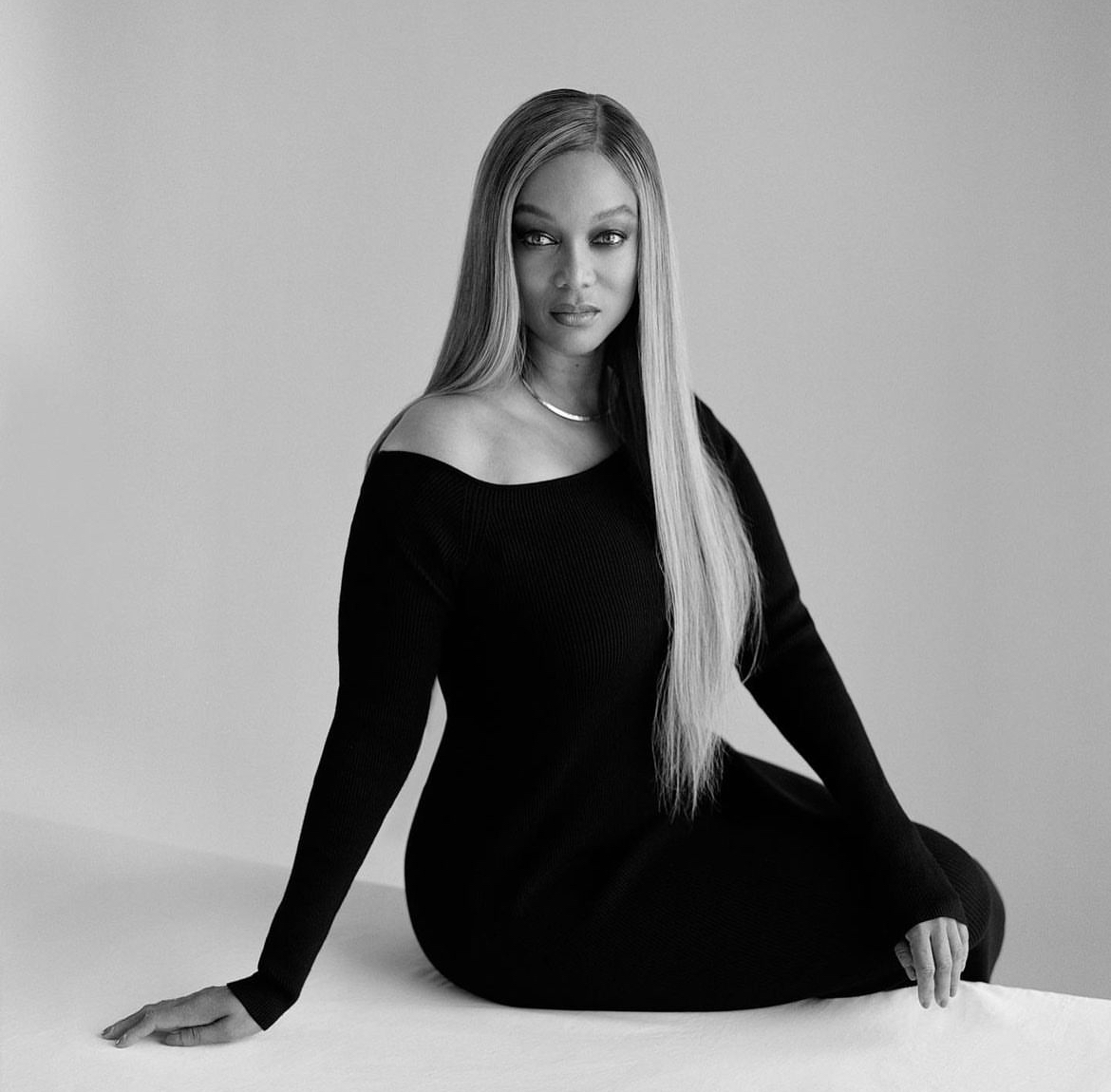 Tyra Banks posing in an all-black outfit.