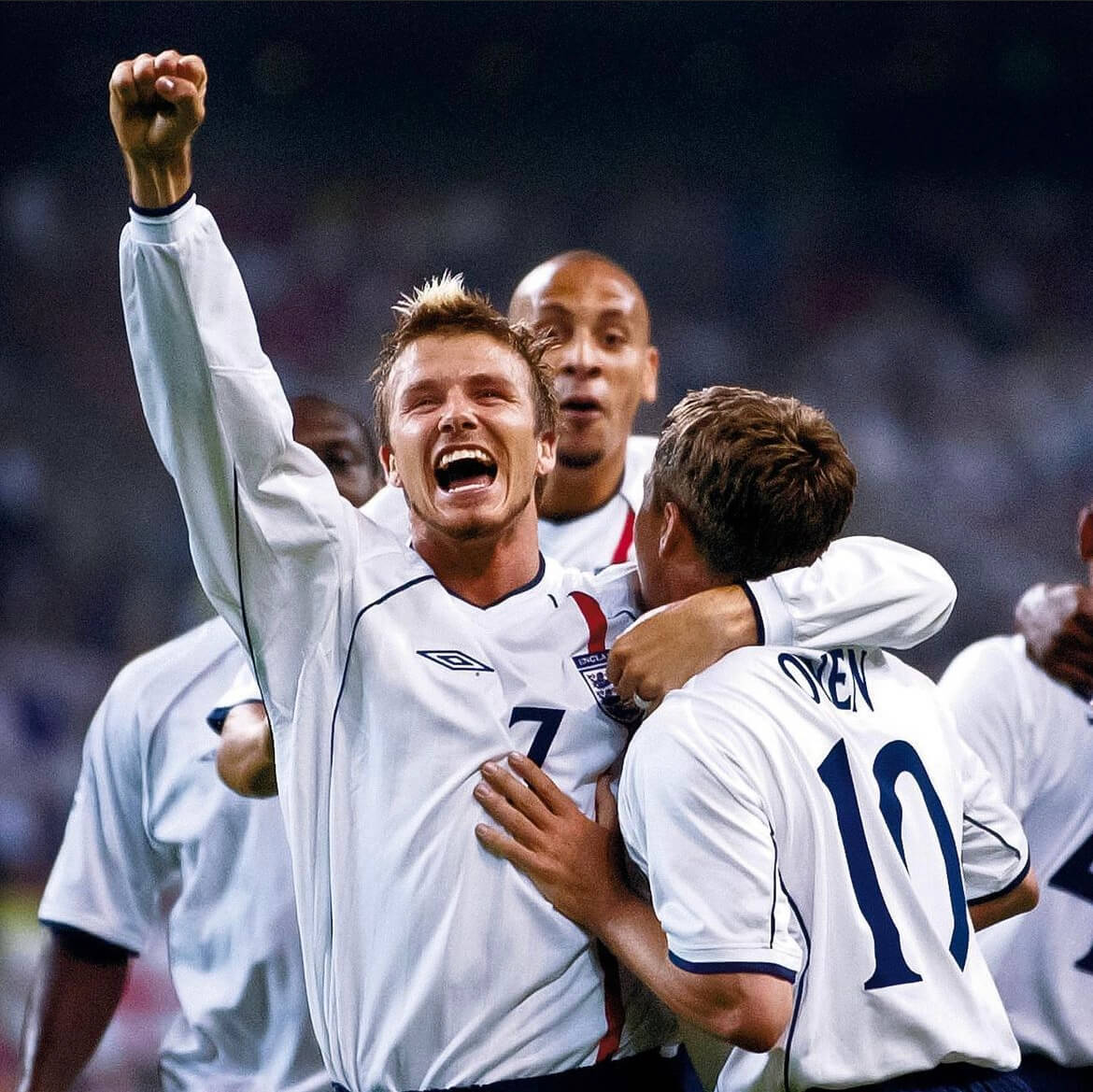 David celebrating with England teammates. 