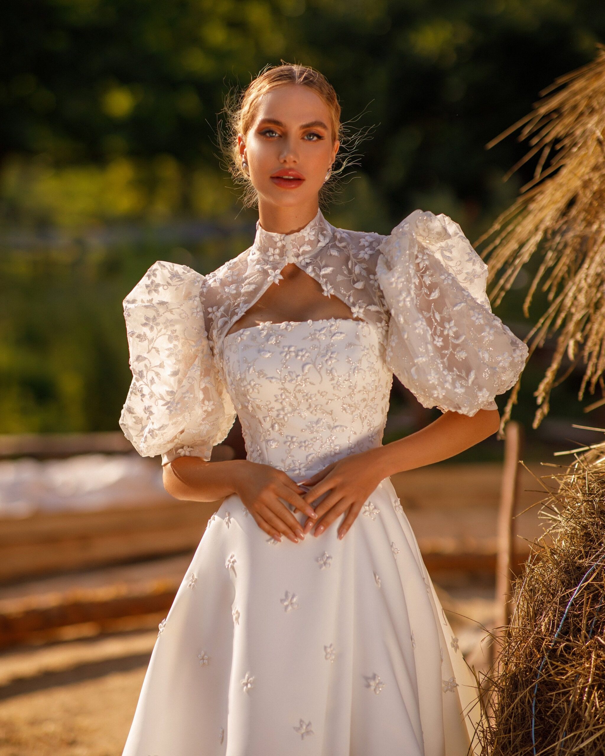 A detachable embroidered bolero on a classic dress
