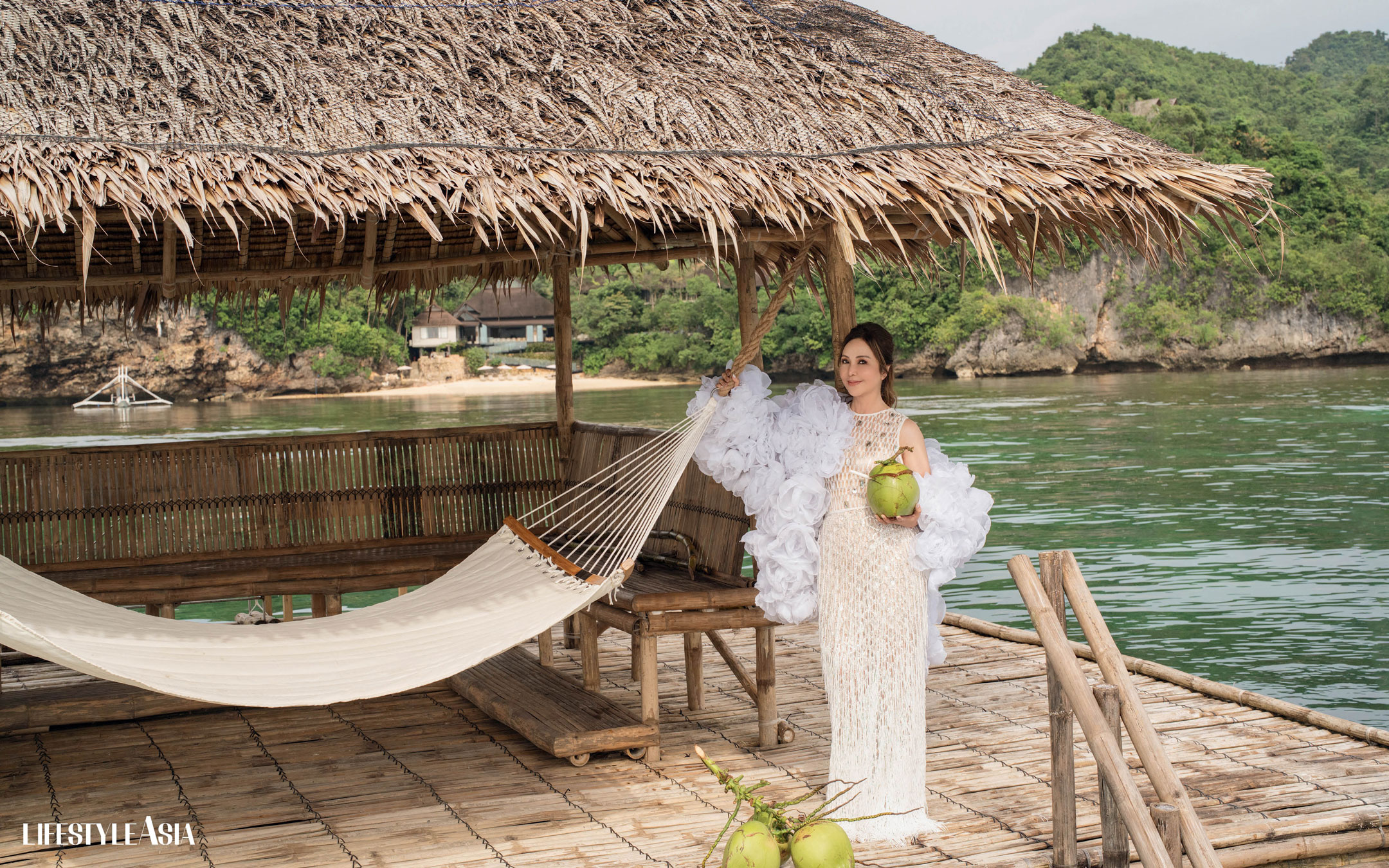 White mesh crystal encrusted midi dress, beaded fringe skirt and organza rosette embellished jacket, NERIC BELTRAN.