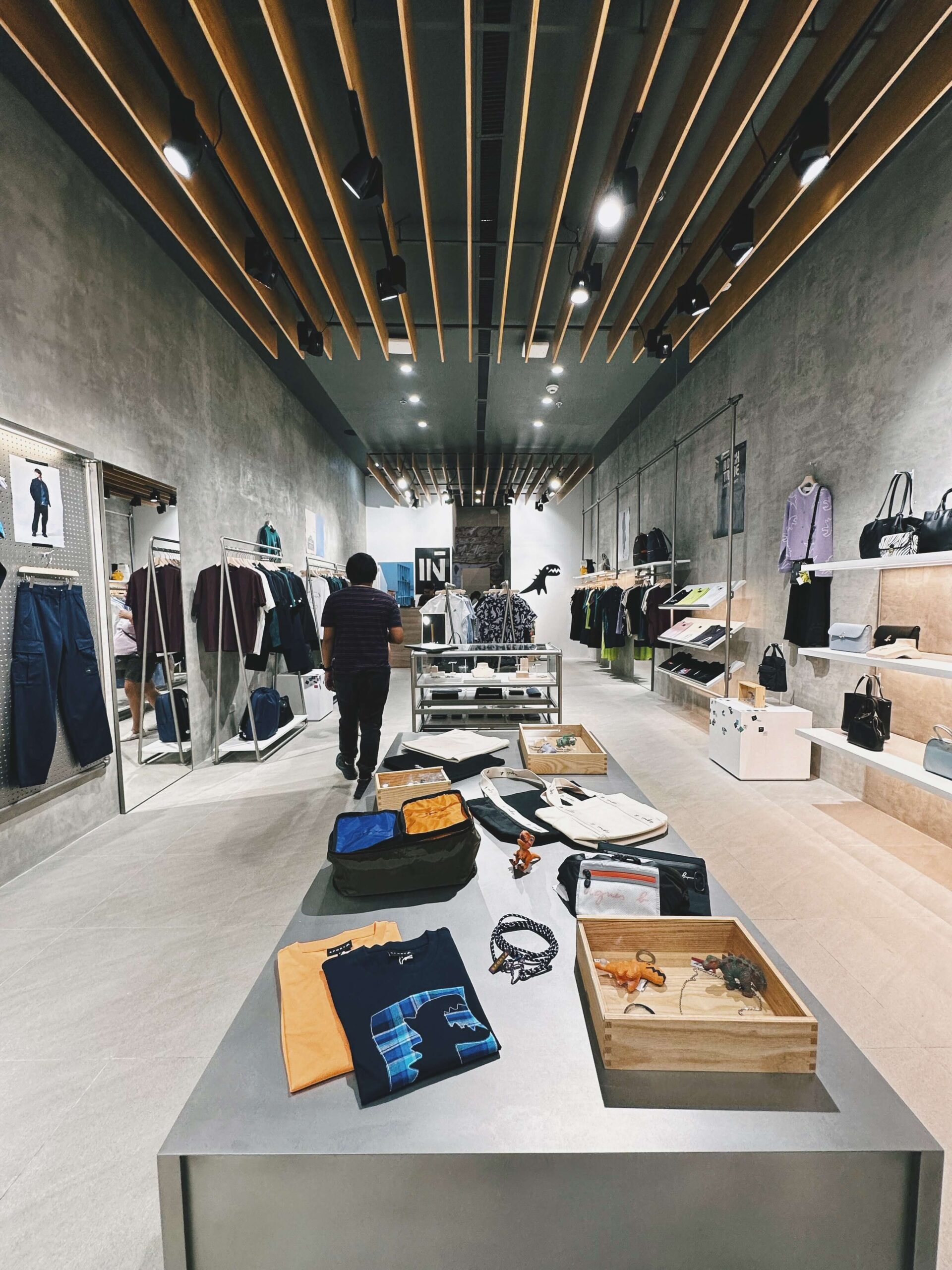 Metallic pieces reference musical instruments and electronic music, which completes the boutique’s themes